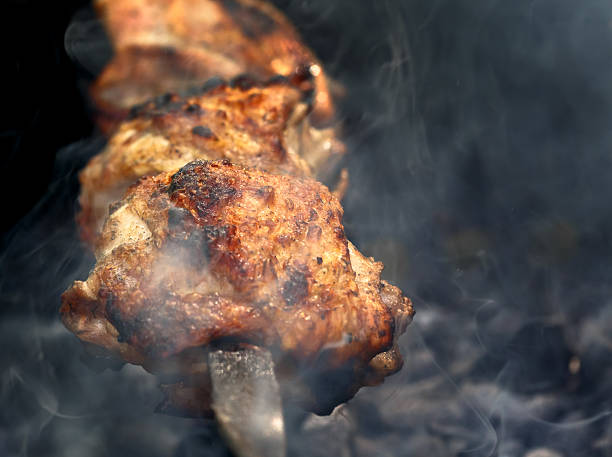 istock meat skewers on the barbecue coals 543574598