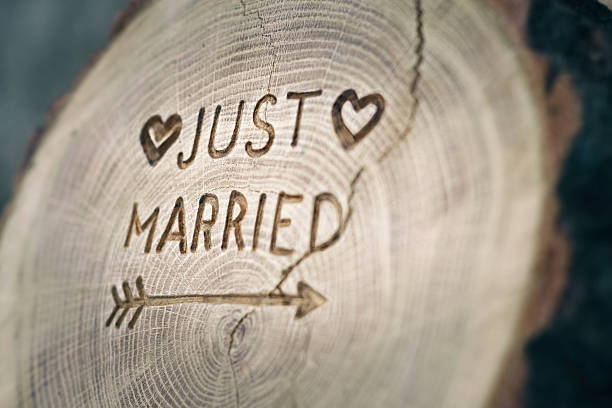 Woodcarving. Newlyweds, Just married, inscription on the wedding. Background stock photo