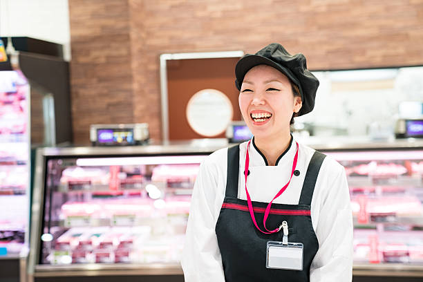雌ブッチャー、スーパーマーケット - supermarket sales clerk grocer apron ストックフォトと画像