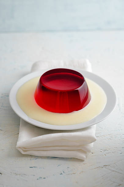 istock Red jelly with vanilla sauce 543580276