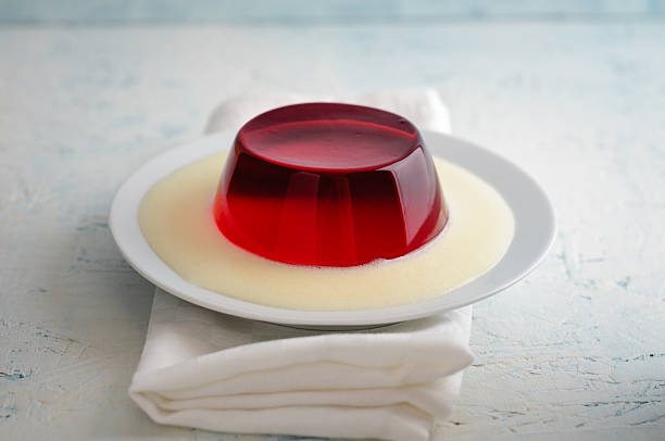 istock Red jelly with vanilla sauce 543580642