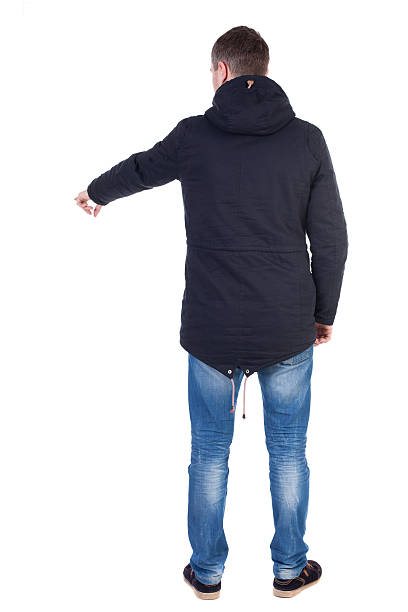 istock Back view of  pointing young men 543582034