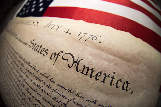 istock Declaration of independence 4th july 1776 on usa flag 543582740