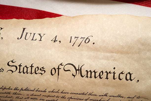 istock Declaration of independence 4th july 1776 on usa flag 543582804