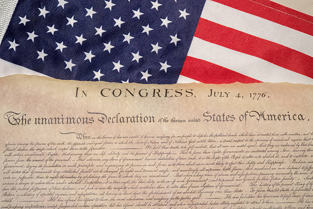 istock Declaration of independence 4th july 1776 on usa flag 543582898