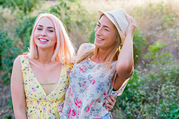 istock summer holidays and vacation - girls smiling 543584422