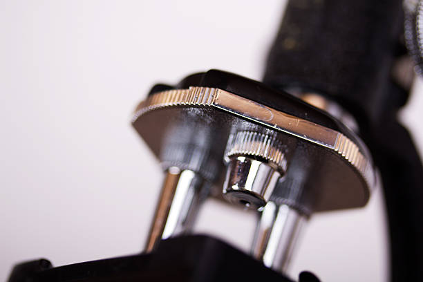 istock Close up of lenses on a science microscope 543588056