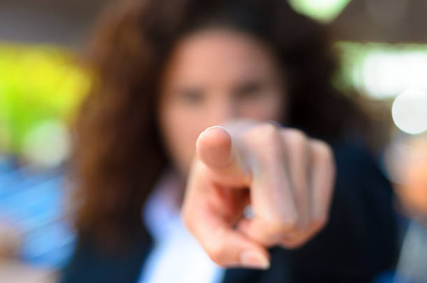 istock Woman pointing an accusatory finger at the camera 543590686