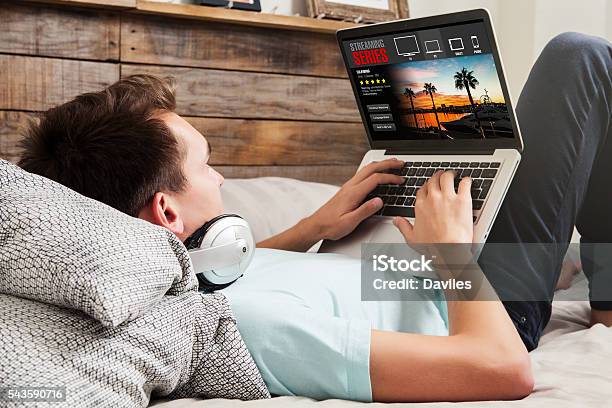 Watching Tv Series At Home Stock Photo - Download Image Now - Downloading, Watching, Television Industry