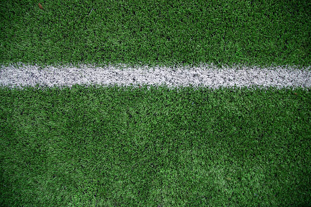 istock White stripe on the green soccer field 543591016