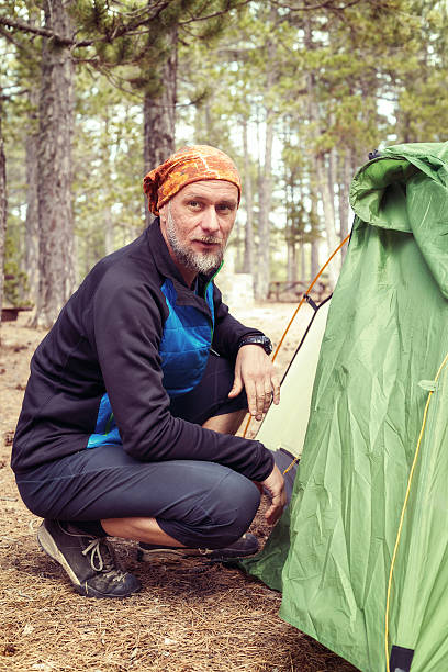 istock Bearded man, hiker sitting near tent 543595564