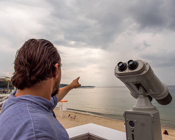 Man pointing at the distance stock photo