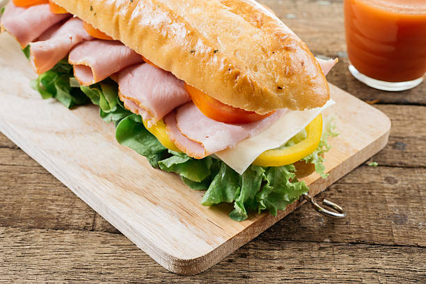 istock Food series : Baguette ham sandwich on wooden board 543598324