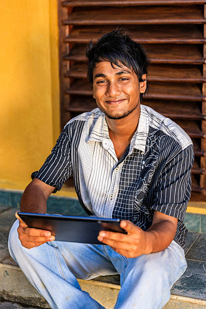 istock Sri Lankan teenager using a digital tablet 543598590