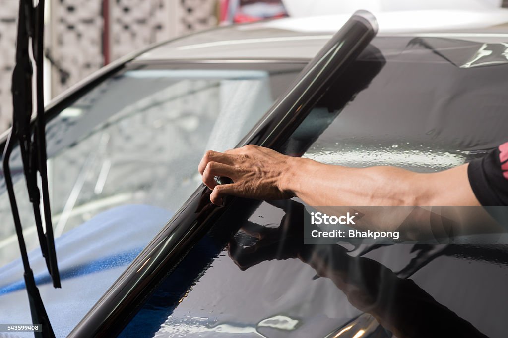 Car window tinting series : Installing car window tint Installing car window tint Car Stock Photo