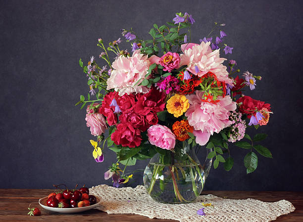 istock Still life with a summer bouquet and berries 543599510