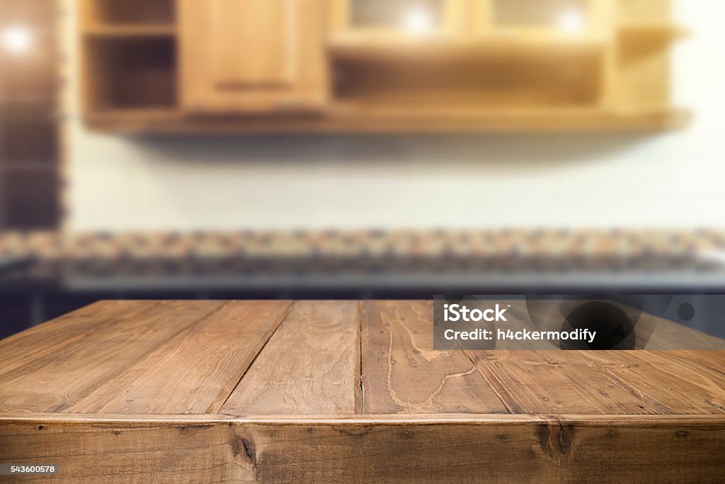 Wood desk space and blurred of kitchen background. Wood desk space and blurred of kitchen background. for product display montage. business presentation.Wood desk space and blurred of kitchen background. for product display montage. business presentation. Wood - Material Stock Photo