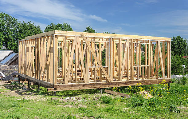 istock New wooden house post and beam construction 543653148