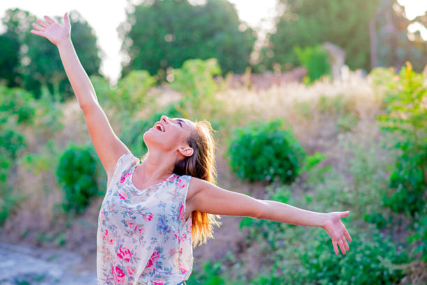 istock freedom, women with arms raised 543656108