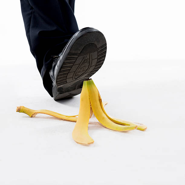 istock Businessman stepping on banana skin 543656852