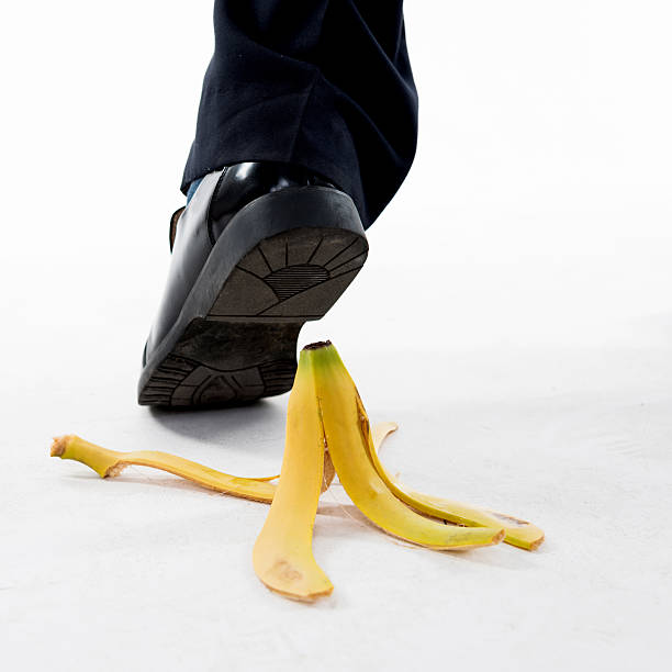 istock Businessman stepping on banana skin 543656924