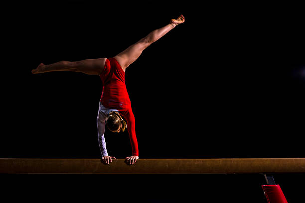 istock Female Gymnast on Balance Beam 543657028