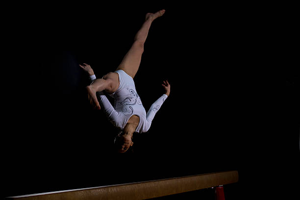 istock Female Gymnast on Balance Beam 543657092