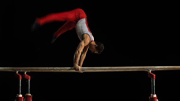istock Male gymnast on parallel bars 543657752