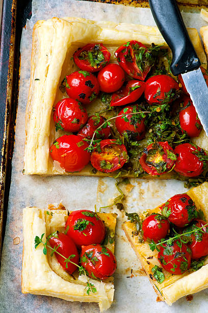 istock tart with cherry tomatoes and herbs 543657886