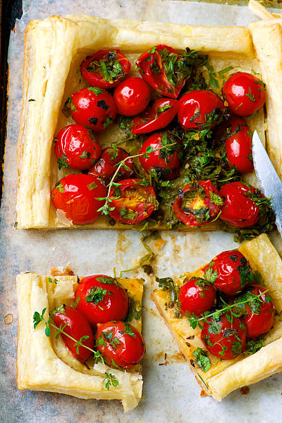 istock tart with cherry tomatoes and herbs 543657900