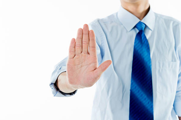 istock Businessman show STOP against white background 543658018