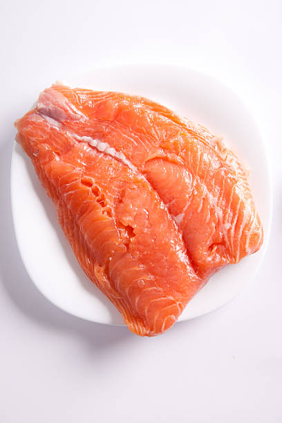 Raw salmon in a white plate
