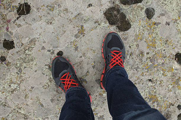 istock Vibrant tourist sneakers on a rock 543658336