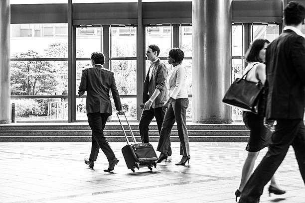 Mixed group of business executives at a convention center.