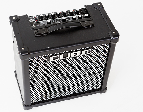 Cape Town, South Africa - June 29, 2016:  High-angle view of  Roland Cube 80GX guitar amplifier, showing the controls. Made by the Japanese giant Roland that also makes Boss guitar effects, the Cube is a long-running series of solid-state guitar amplifiers, with onboard digital emulations of famous tube amps, noted for their price:performance ratio. This is the current top of the range, an 80-watt model.