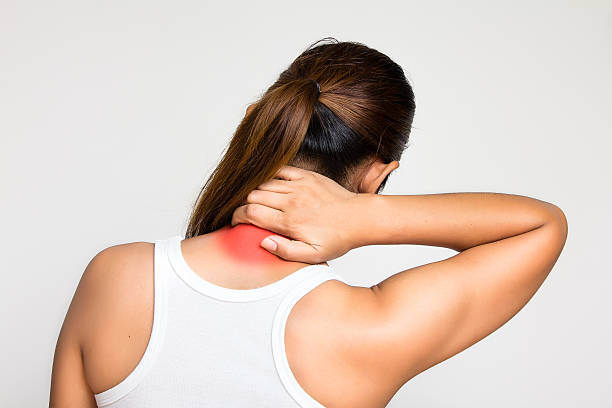 istock girl holds neck in his hands 543658740