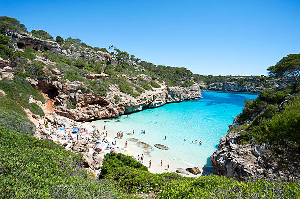 istock Beautiful turquoise clear water at Majorca beach, Calo des Moro, 543659512