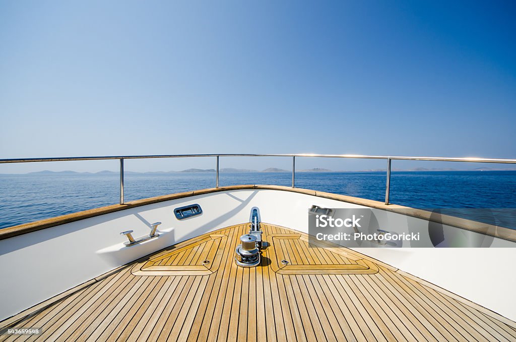 Wide angle shot of front of the yacht Wide angle shot of front of the yacht in summer timeWide angle shot of front of the yacht in summer time Yacht Stock Photo