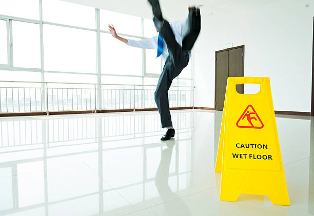 istock Businessman slipping on wet floor 543661722