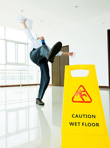 istock Businessman slipping on wet floor 543661758