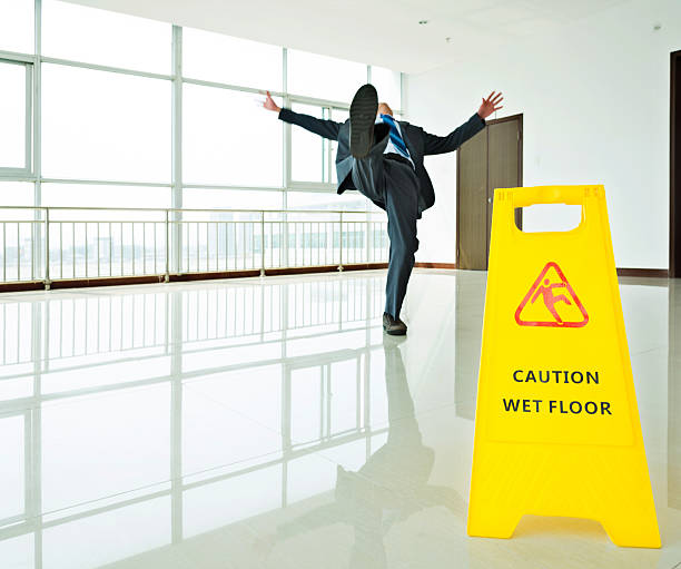 istock Businessman slipping on wet floor 543661806