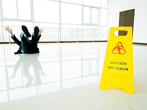 istock Businessman slipping on wet floor 543661882
