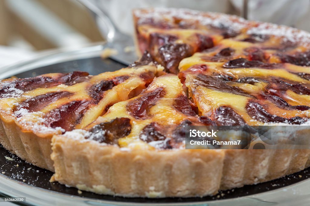 Freshly baked plum pie in organic bakery Freshly baked plum pie in organic bakery closeup American Culture Stock Photo