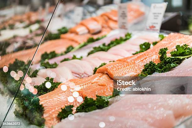 Seafood Stand With Cuts And Filets Of Salmon And Tuna Stock Photo - Download Image Now