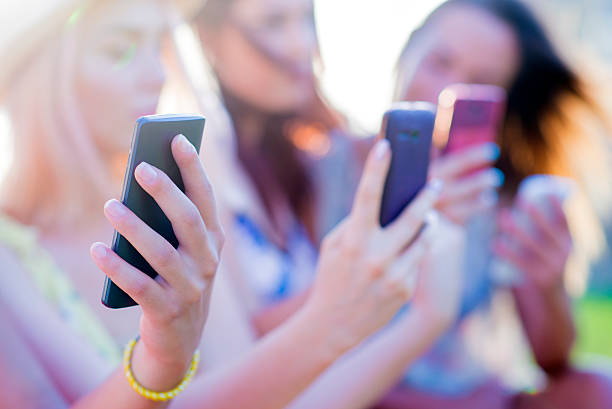 istock Group of college students holding smartphones 543662200