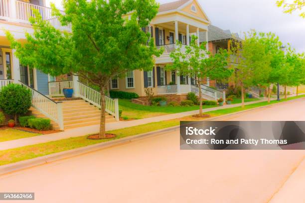 Old Fashioned Home Town Street With Gardens And Porches Stock Photo - Download Image Now