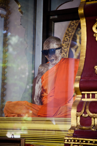 Koh Samui, Thailand - December 17 : Mummified monk body in a glass sarcophaguson the Day of St. Lucia, December 17, 2012.