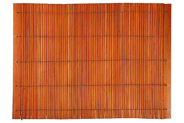 istock Orange brown vintage bamboo mat isolated on white 543663534