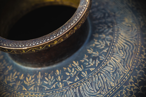 Close-up shot of a vase and its detailed patterns, as seen in Agra, India.