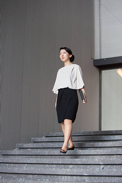 istock Female Business executive carrying her laptop 543663706